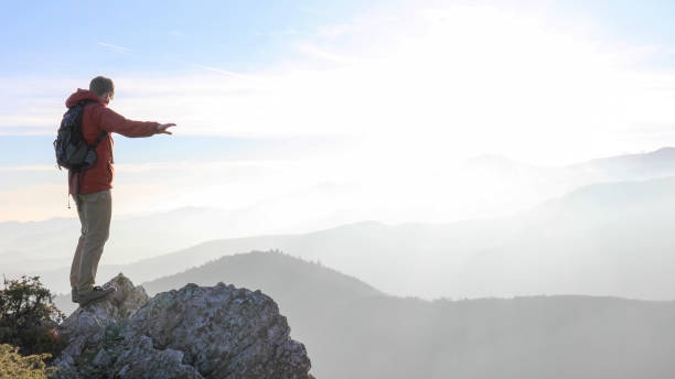 istock Male hiker ascends mountain ridge 1217216802