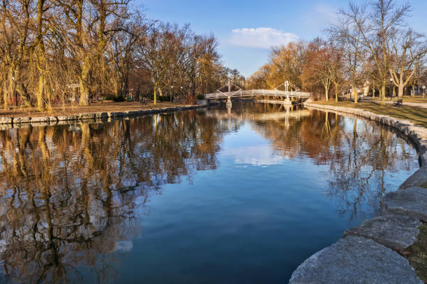 Victoria Park in Kitchener, Ontario, Canada View at the bridge over the pond in Victoria Park, Kitchener, Ontario, Canada. kitchener ontario photos stock pictures, royalty-free photos & images