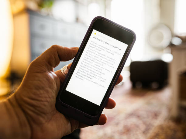 istock COVID-19, alert warning on mobile phone 1217218469