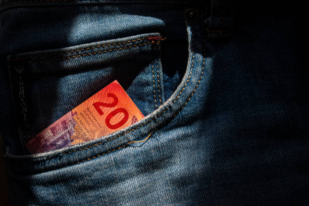 istock Twenty Swiss francs paper note in jeans pocket. 1217218683