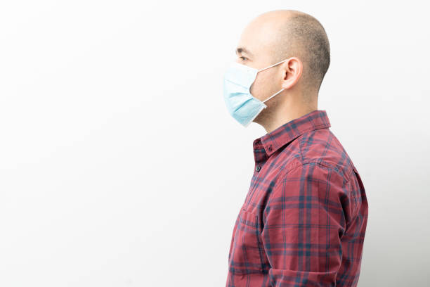 istock Bald man with a surgical mask 1217219701