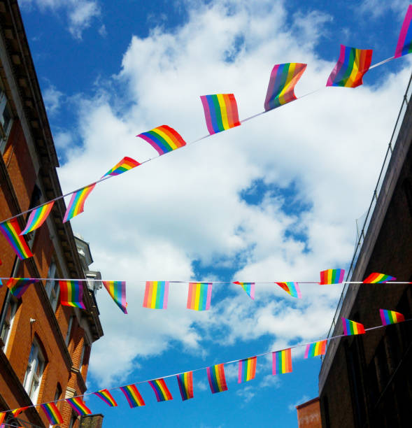 istock Pride flags against blue sky in Chinatown, London, UK 1217223243