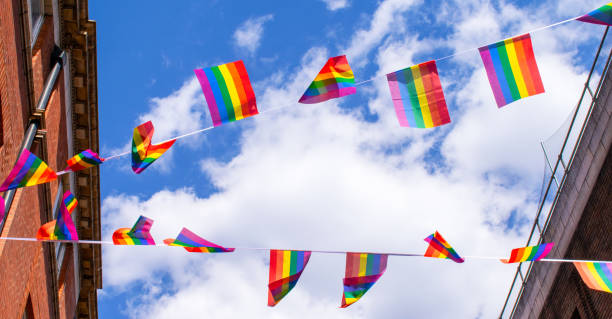 istock Pride flags against blue sky in Chinatown, London, UK 1217224062