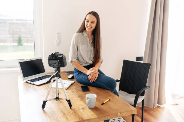 istock Young woman records video lessons on camera 1217224264