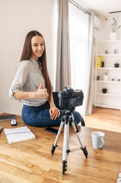 istock Young woman records video lessons on camera 1217224270