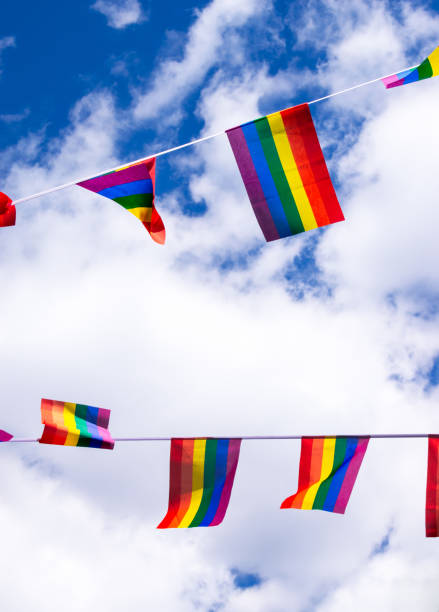 istock Pride flags against blue sky in Chinatown, London, UK 1217224310