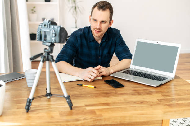 istock Young man teaches and records video lessons 1217224541
