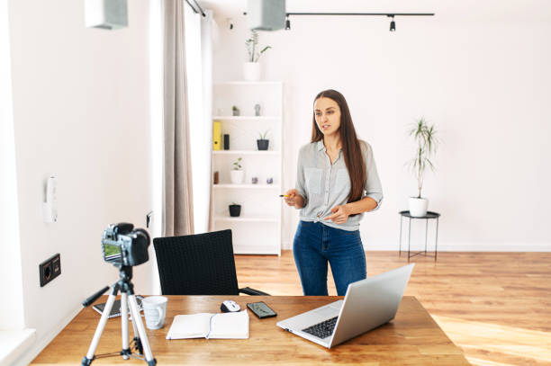 istock Young woman records video lessons on camera 1217224615