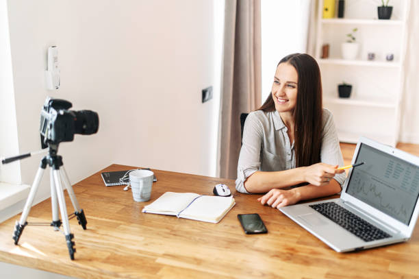 istock Young woman teaches and records video lessons 1217224627