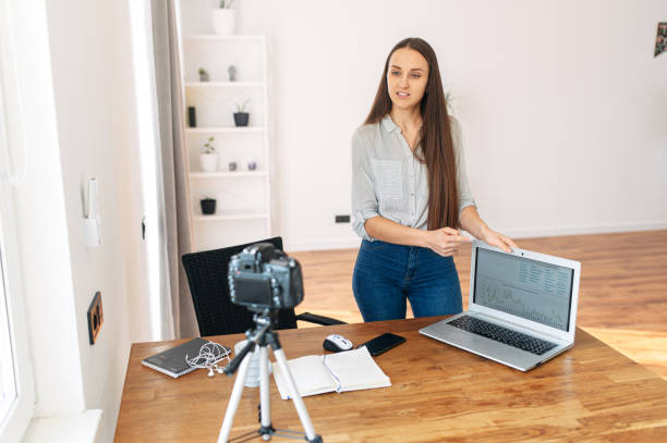 istock Young woman records video lessons on camera 1217224629