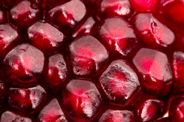 istock fresh pomegranate seeds macro close up in drops 1217224914