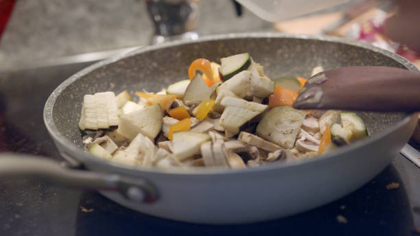 istock View of chef cooking vegetarian meal 1217225955