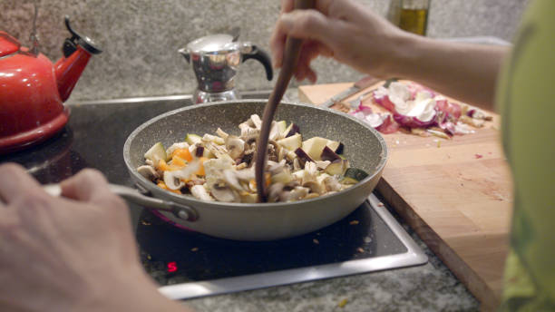 istock Female chef cooks vegetarian meal 1217225992