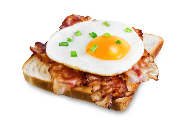istock Fried egg fried bacon sandwich on a white isolated background 1217226297