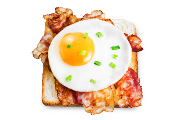 istock Fried egg fried bacon sandwich on a white isolated background 1217226307