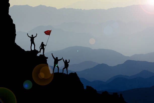 extraordinary mountains, challenging territories and successful team work stock photo