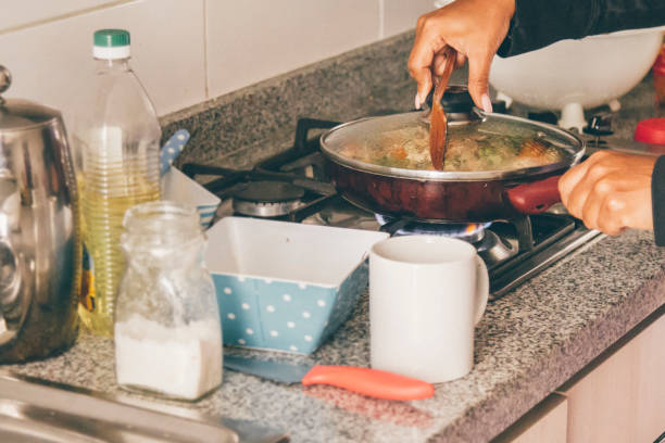 istock A self isolate woman cooking in Covid-19 Corona Virus time. 1217227731