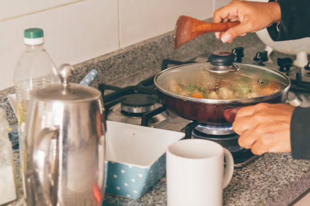 istock A self isolate woman cooking in Covid-19 Corona Virus time. 1217227772