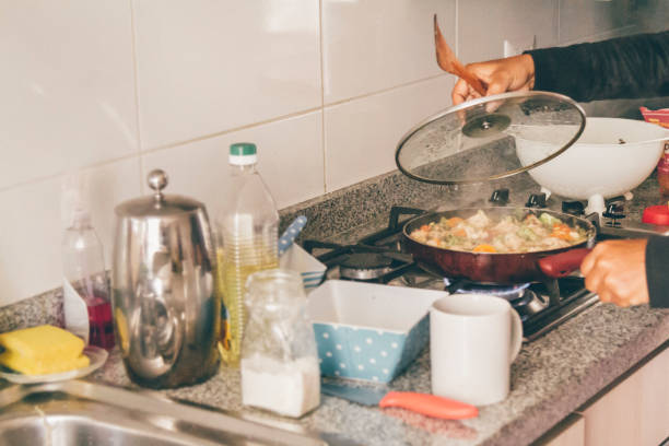 istock A self isolate woman cooking in Covid-19 Corona Virus time. 1217227930