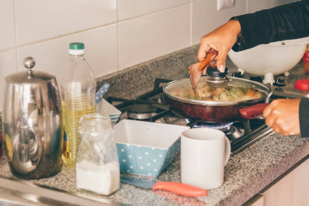 istock A self isolate woman cooking in Covid-19 Corona Virus time. 1217227960