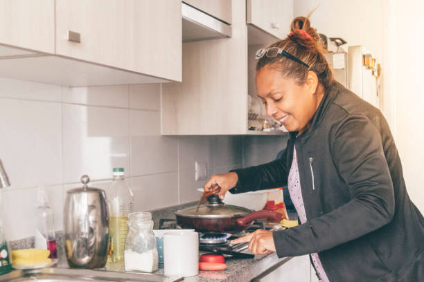istock A self isolate woman cooking in Covid-19 Corona Virus time. 1217227962