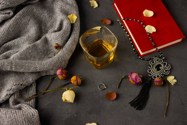 istock Ornaments and a book on a dark background 1217228994