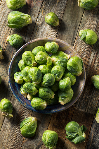 Raw Organic Green Brussel Sprouts in a Bowl