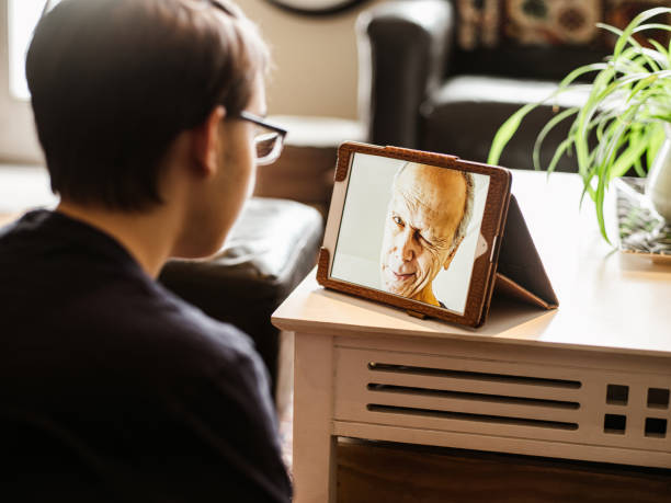 istock COVID-19, talking to grandpa during lockdown 1217230459