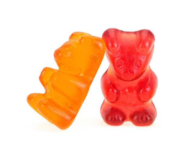 Two colorful gummy bears isolated on a white background. Jelly bears. Two colorful gummy bears isolated on a white background. Jelly bears. gummi bears photos stock pictures, royalty-free photos & images