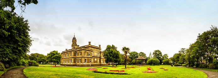 Panoramic image of Llanelli Town Hall from the viewpoint of the gardens.