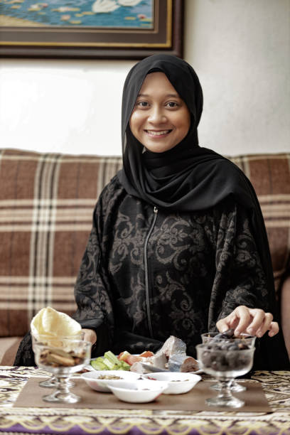 istock Muslim family eating iftar during ramadhan at home 1217231981