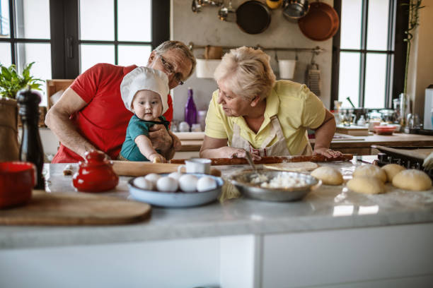 istock Grandparents baking together with baby boy 1217232071