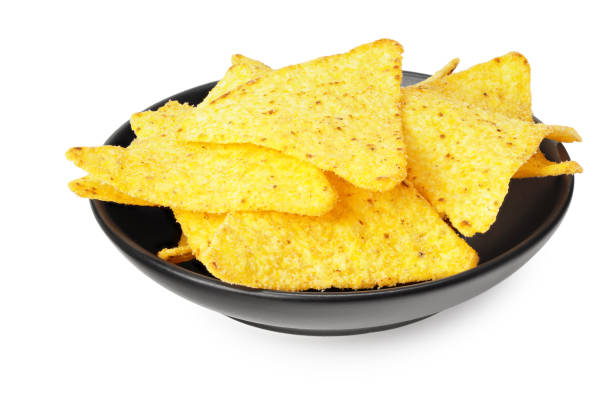 istock corn chips nachos in a black plate isolated on white background 1217232141