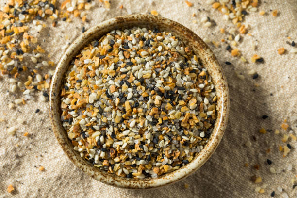 raw organic everything bagel seasoning - sesame seed spoon variation fotografías e imágenes de stock