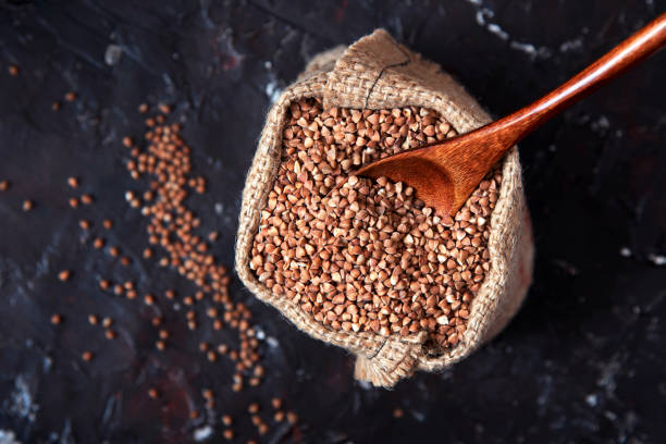 istock buckwheat groats in burlap sack on dark background 1217235053