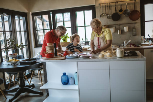 istock Little boy baking with grandparents 1217235321