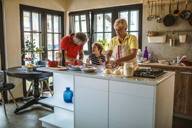 istock Little boy baking with grandparents 1217235876