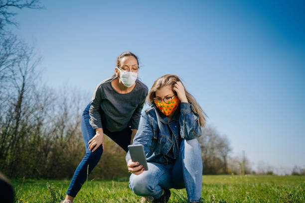 istock Women In The Nature Wearing Protective Face Masks 1217236072