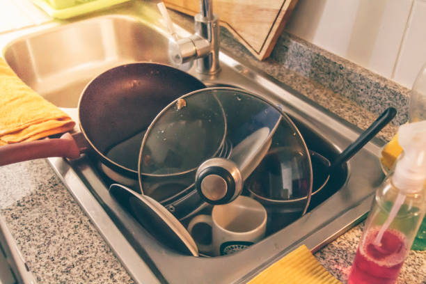 istock Dirty dishes in a messy kitchen 1217236195