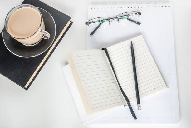 istock Notepad, a up of coffee, and a pencil. Copy space, work from home, workplace 1217236492