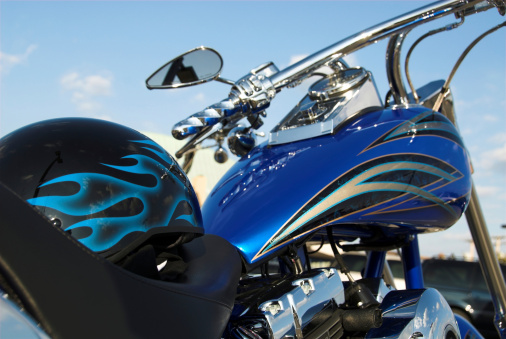 Valras - France - 28 July 2022 - Profile view of Harley Davidson motorbike parked on the beach