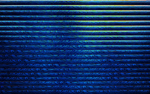 Dark blue background with abstract pattern stripes and glow.