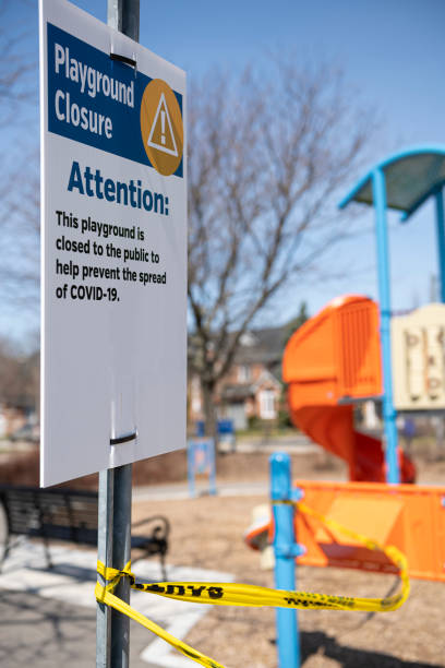 istock Covid-19 warning sign in park area 1217242561