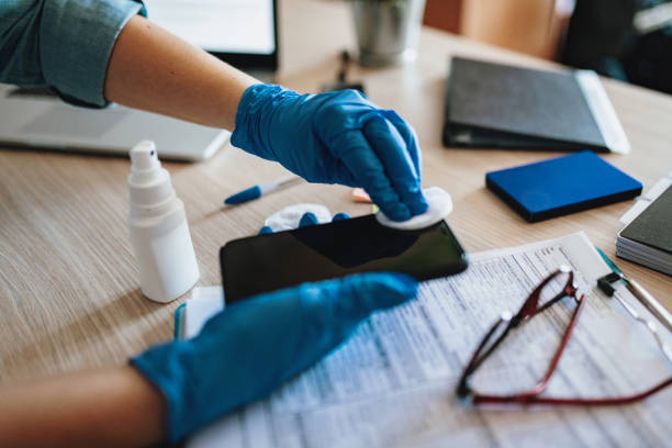 istock Disinfection of mobile phone surface with alcohol or antiseptic solution 1217243764