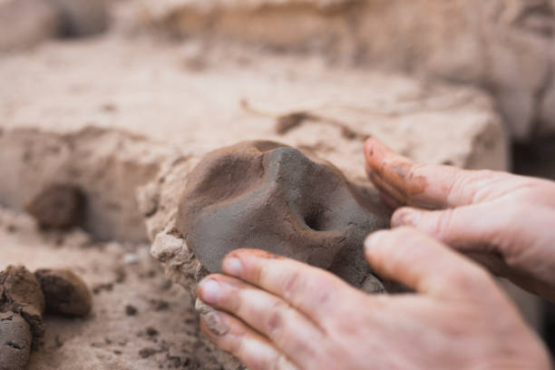 istock Hands of a person making a clay sculpture. 1217245464
