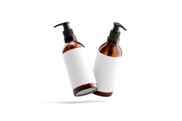Blank amber glass pump bottle with white mockup, no gravity, 3d rendering. Empty lotion or oil pumppack with sticker mock up, isolated. Clear body or face cleanser container mokcup template.