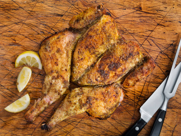 istock Roasted Spatchcock Lemon Chicken on a Cutting Board 1217246697