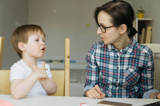 istock Son tells something to mom 1217249896