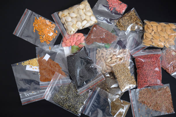 istock organic seeds packed in a wide variety on black ground, 1217251870