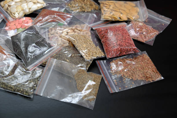 istock organic seeds packed in a wide variety on black ground, 1217251885